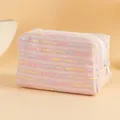 Quilted pink tweed makeup bag with colorful stripes and secure white zipper closure - Pink with Colorful Lines