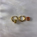 Detail of 18k gold earrings with natural stone pendants on soft satin fabric - 2.5*10mm / Unakite