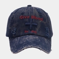 Macro view of distressed denim texture and red cross embroidery on baseball cap - Navy Blue