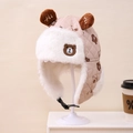 Close-up of diamond-quilted kids winter trapper hat with furry bear ears and chin strap - Kids approx 3-10 years / Deep Beige