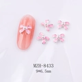Detailansicht 9x6,5mm Nagelkunst-Schleife in Rosa mit weißer Perle und Silberrand - Rosa Emaille Silberrand Schleife (8433)