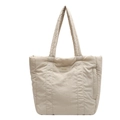 Minimalist beige quilted nylon tote bag with ENRE logo label on a clean white background - Off White