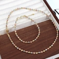 Three-tone striped geometric bead necklace and bracelet set in gold, silver, and rose gold - Set