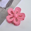 Detailed view of the pink matte flower hair claw clip with its durable grip structure - Rose Red