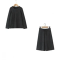 Close-up of dark grey knit texture on round neck sweater and wide-leg trousers set - One Size / Gray