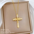 Detailed view of a gold cross pendant necklace with inset diamonds in a beige gift box - Cross Infinity Style (K520)