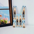 Blue knit tote bag with orange ethnic geometric patterns and integrated handles - Lavender