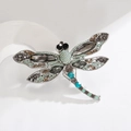 Elegant dragonfly brooch with grey crystals and turquoise beads in a silver setting - Colorful Silver