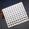 Macro detail of gunmetal grey acrylic face rhinestones in various sizes on a sheet - Gunmetal Black Flatback Gems in Multiple Sizes (E44)