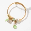 Pulsera corazón de acero dorado con piedra ojo de gato verde y colgante de cisne - Verde