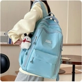 Water-resistant light blue student backpack shown from a side view on a model - No Pendant / Blue
