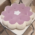 Soft purple flower plush seat cushion with white petal center on a minimalist chair - Purple