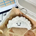 Handmade white wool felt cloud keychain with smiling face in paper gift box packaging - Dumpling Cloud