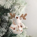 Cute plush reindeer Christmas ornament with brown plaid scarf on snowy tree branch - Christmas Reindeer