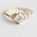 Elegant gold plated ring featuring a princess cut square zircon and pave side stones - US 7 / Gold