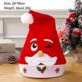 Cartoon Santa Claus Christmas hat with LED lights in soft red non-woven fabric 28x38cm - Adult Expression Santa Hat Squinting