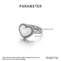 Titanium steel heart ring featuring white shell inlay and side rhinestone accents - Size 6 / Ring / Steel