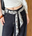 Classic paisley print long silk scarf worn as a stylish belt on navy wide-leg jeans - Black and White Paisley Waist Decor