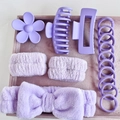 Flat lay of purple hair accessory set featuring matte clips, plush headband and elastic bands - Purple (16-Piece Set)