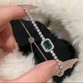 Macro detail of silver tennis bracelet with emerald green stone and adjustable slider - 35# Silver Emerald Green Style