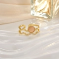Close-up of golden double-layer ring featuring a pink opal stone and zircon accents - Pink Opal Wave Double Layer (JZ0149A)