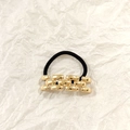 Elastic hair tie featuring a hollow gold square chain link metallic decorative accent - Gold Chain Strap 5.5cm