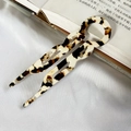 U-shaped acetate hair fork with vintage tortoise shell pattern on white silk fabric - Coffee White Floral