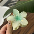 Macro detail of jelly-texture frangipani hair claw clip with green gradient and glitter - Plumeria Jelly Texture / Pale Green