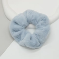 Close-up of light blue plush scrunchie with soft faux rabbit fur texture on a neutral background - Sky Blue