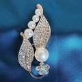 Detail of rose gold brooch featuring white pearls and rhinestones on blue silk fabric - Pearl Petal Brooch