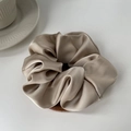 Champagne gold satin silk scrunchie with a glossy texture for an elegant hair look - Beige