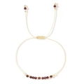 Handmade adjustable cord bracelet with red faceted garnet beads and gold metal accents - January-Garnet