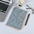 Grey faux leather A5 business notebook with orange edges on a professional desktop - A5 / Cyan