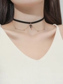 Detailed close-up of a black velvet choker featuring a gold chain and a black cross pendant - 30+7cm / Black