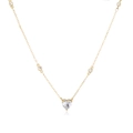 Macro shot of gold heart necklace featuring pavé-set clear zircons and round accent stones - Gold White Zirconia