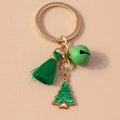 Detail showing Christmas keychain with green bell, tassel, and Christmas tree charm - Green Christmas Tree