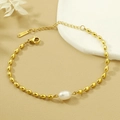 Elegant gold stainless steel beaded bracelet featuring a natural freshwater pearl center - S146 Single Freshwater Pearl Bracelet Gold