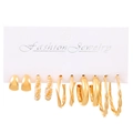 Golden earring set with 6 pairs featuring pearls and twisted hoop designs on white card - Kc Gold 1032
