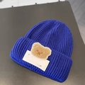 Blue knitted baby beanie featuring a cute brown plush bear patch with embroidery - LUCK Bear Blue