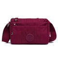 Deep red multi-pocket nylon crossbody bag for women with adjustable shoulder strap - Dark Red