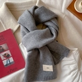 Minimalist grey knitted scarf with woven label on soft wool blend fabric texture - Heather Grey
