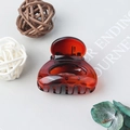 Elegant amber transparent claw clip for high ponytail styling in a minimalist aesthetic - Amber Red