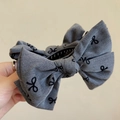 Grey hair claw clip with bow pattern and fabric texture for elegant ponytails - Bowknot Bun Clip / Gray