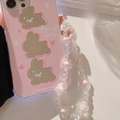 Detail of pink iPhone case with bunny pattern and translucent flower bead wrist strap - Transparent Pink Flower Lanyard