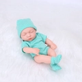 20cm reborn baby doll wearing green polka dot onesie sleeping on white plush - Green Polka Dot Style