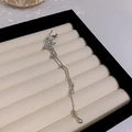 Elegant silver tassel ear cuff with fairy wing design and long chain drops on a tray - Right Ear Elf Wing Drop Tassel (HSLE5310 Right)