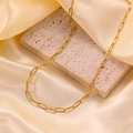 Elegant 18k gold-plated Cuban link chain necklace draped over a decorative stone - H6096 Embossed Simple Chain Necklace Gold