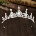 Close-up of vintage silver princess crown with sparkling rhinestones on wood - Silver White Rhinestone