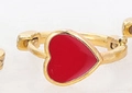 Golden hoop earring with a red enamel heart charm for women, minimalist jewelry style - Red