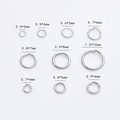 Macro view of silver jump rings in various sizes for DIY jewelry making and craft projects - 0.6x5mm / White Gold